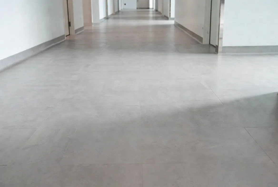 Heat-welded vinyl sheet flooring in a healthcare space