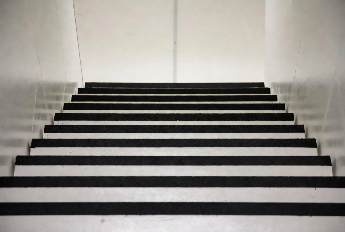 Black rubber stair treads in a commercial stairwell